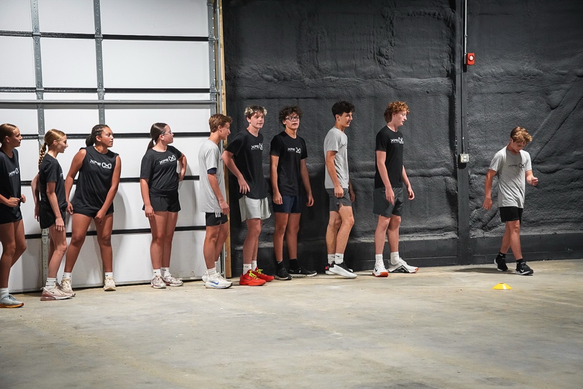 Middle and high school athletes lined up for a drill